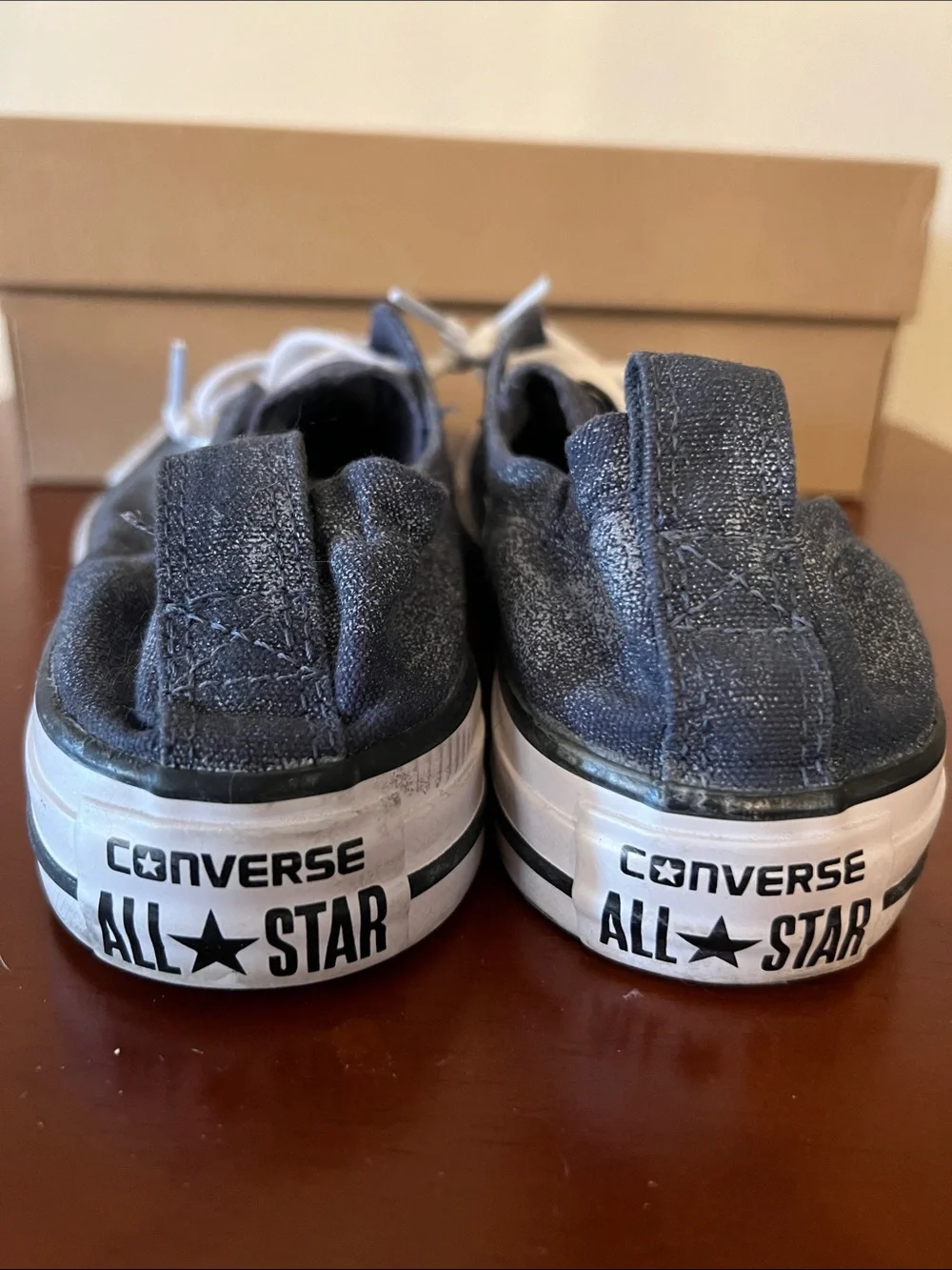Converse slip on blue jean colored All Stars.  Size 6
